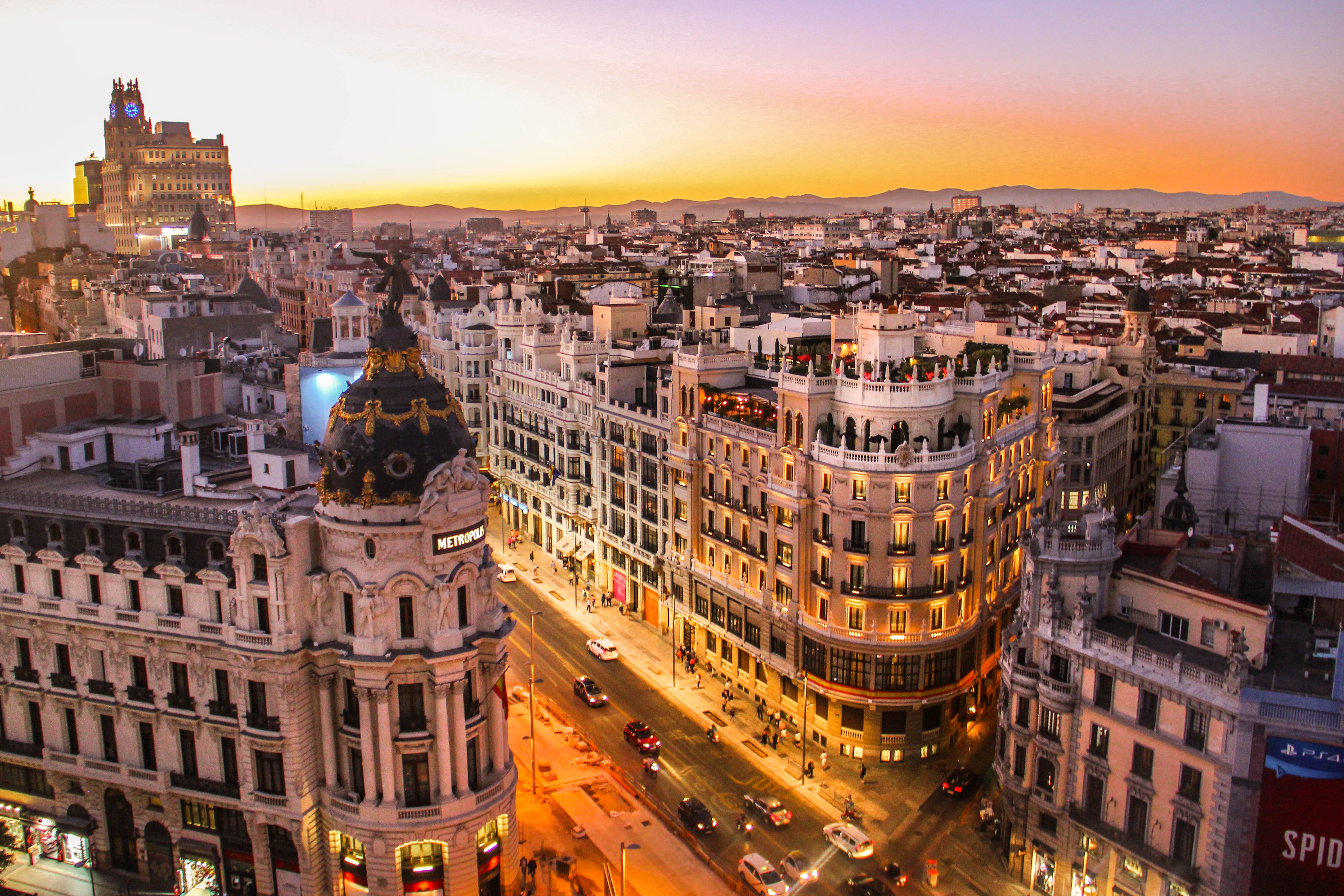 Madrid streets and skyline at sunset