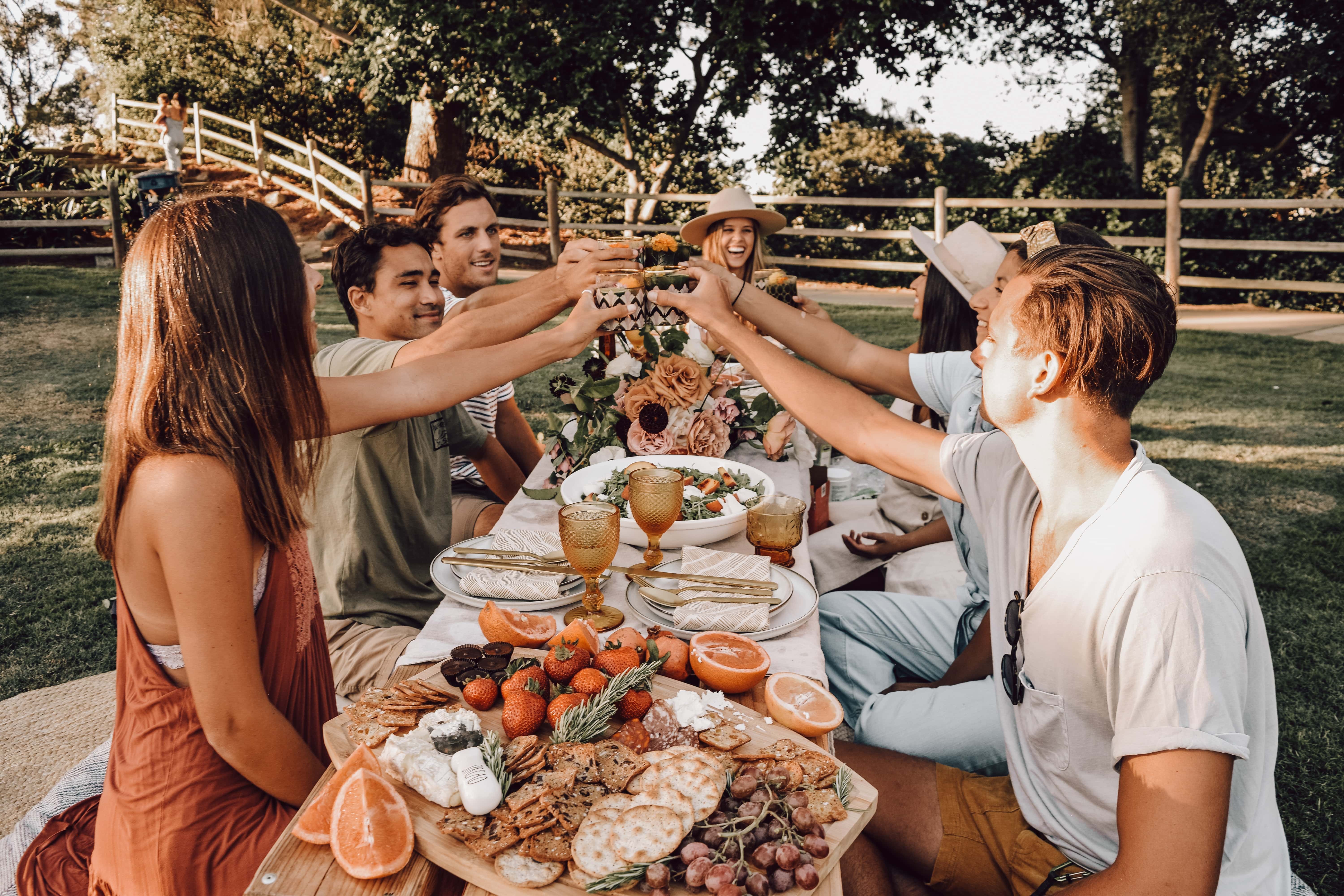 large family gathering outside belonging together