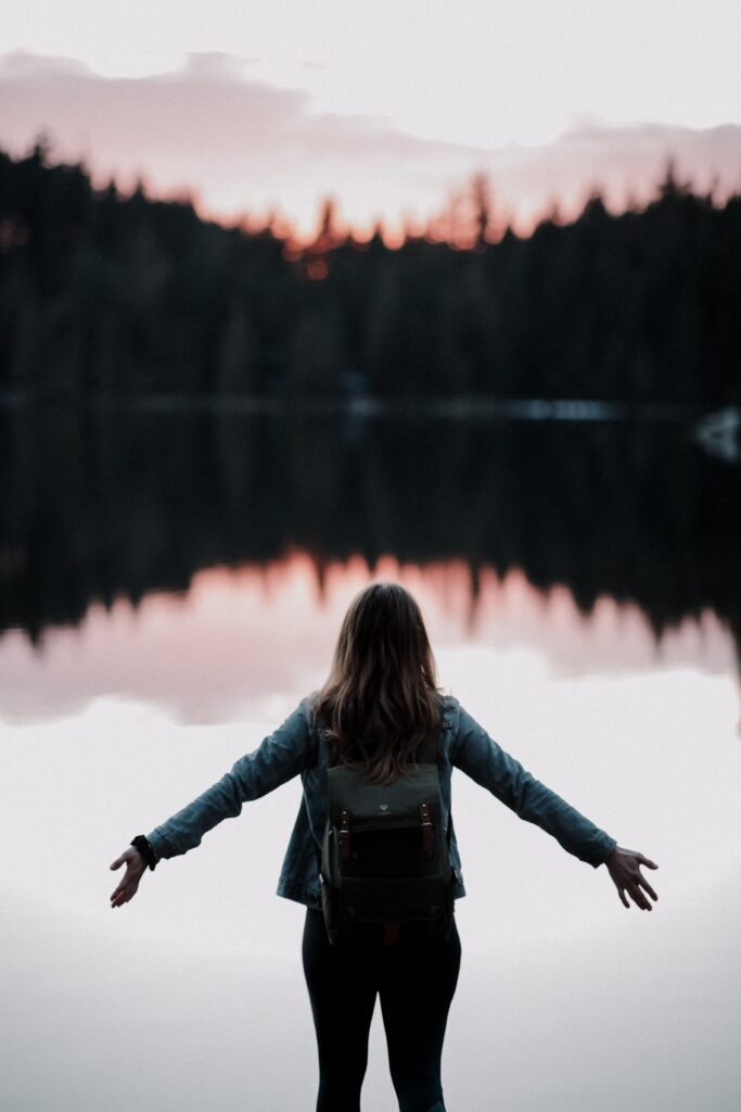 Strong free midlife at peace woman outside in nature