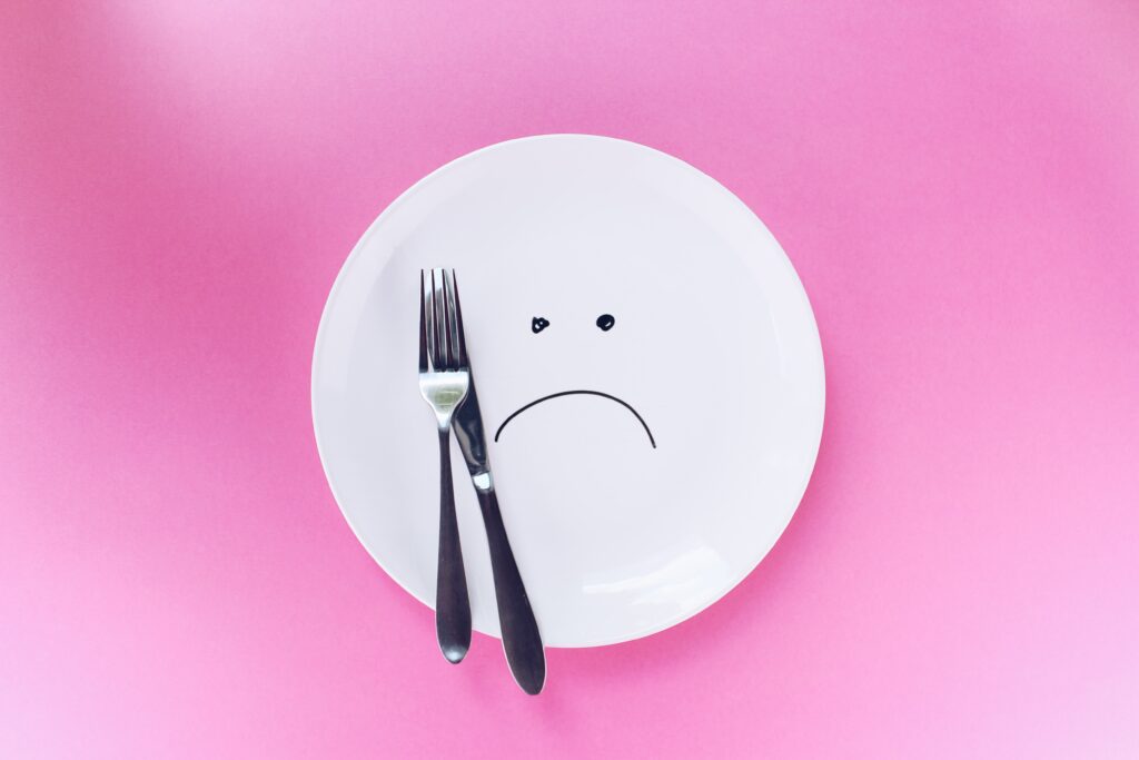 Empty plate with sad face diet