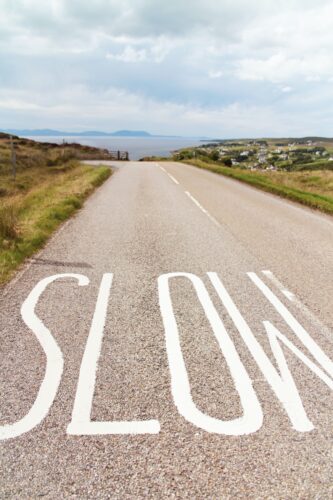 Slow mindful eating written on road