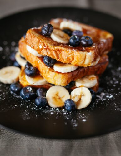 french toast with bananas and blueberries food