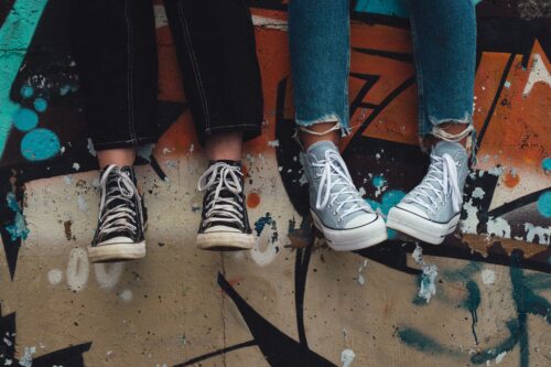 teenagers in trainers dangling feet
