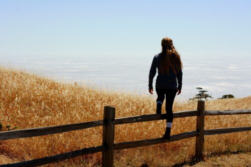 midlife woman overcoming obstacle in nature self care and peace calm overthinking