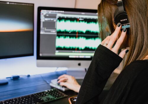 women looking at levels on a computer inner critical voice 